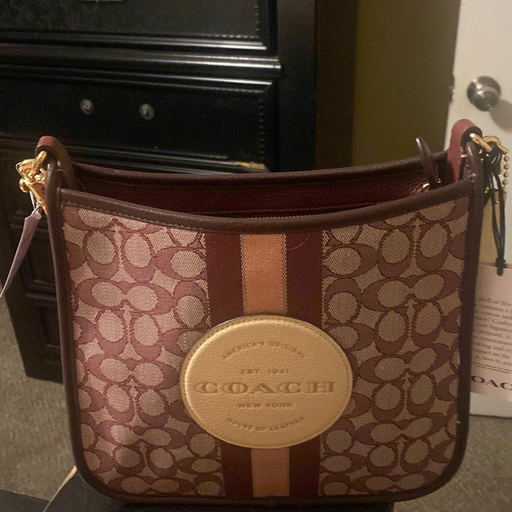 Brand new ladies coach bag with tags wine color